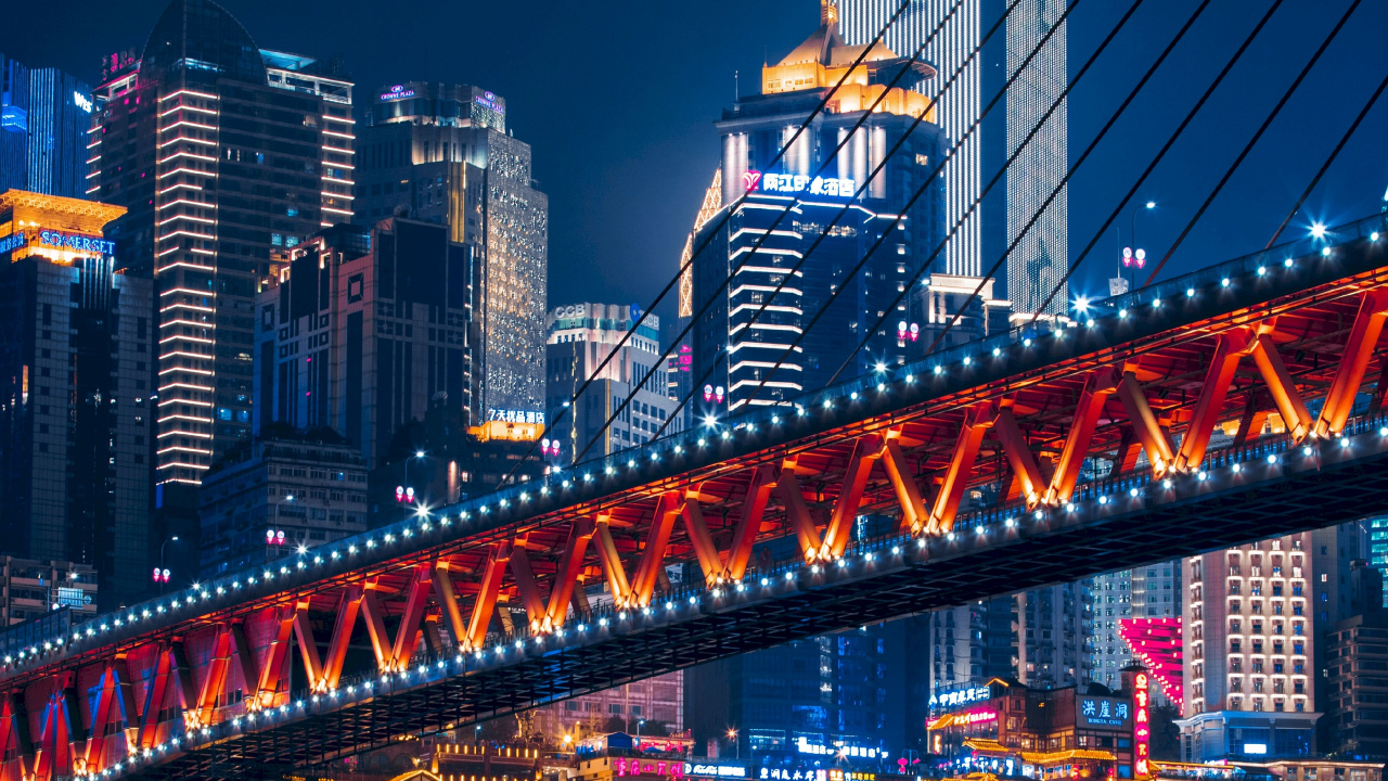 Lighted Bridge Over Water During Night Time. Wallpaper in 1280x720 Resolution