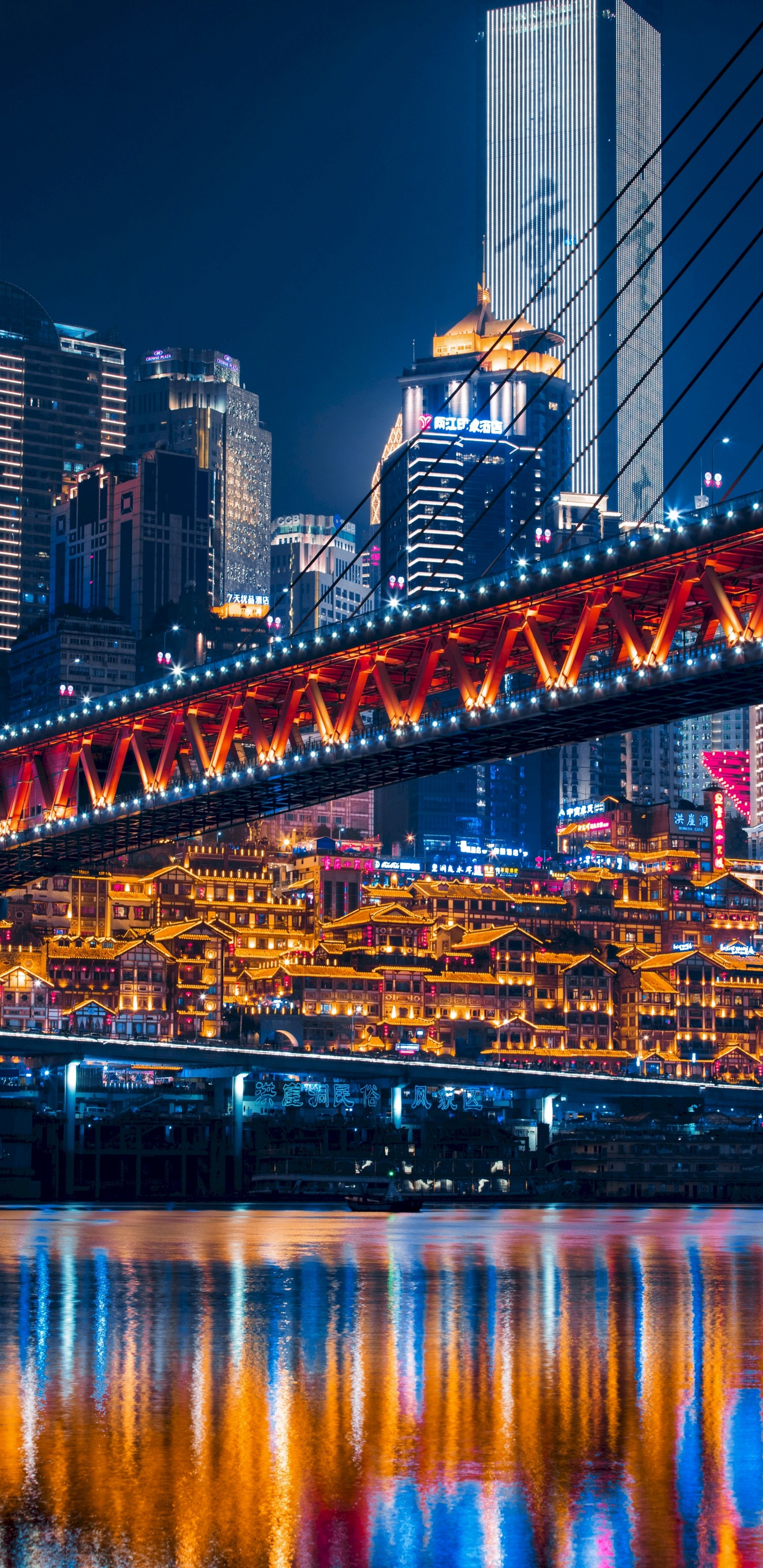 Lighted Bridge Over Water During Night Time. Wallpaper in 1440x2960 Resolution