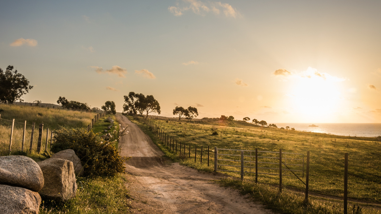 Gray Dirt Road Between Green Grass Field Under White Clouds During Daytime. Wallpaper in 1280x720 Resolution