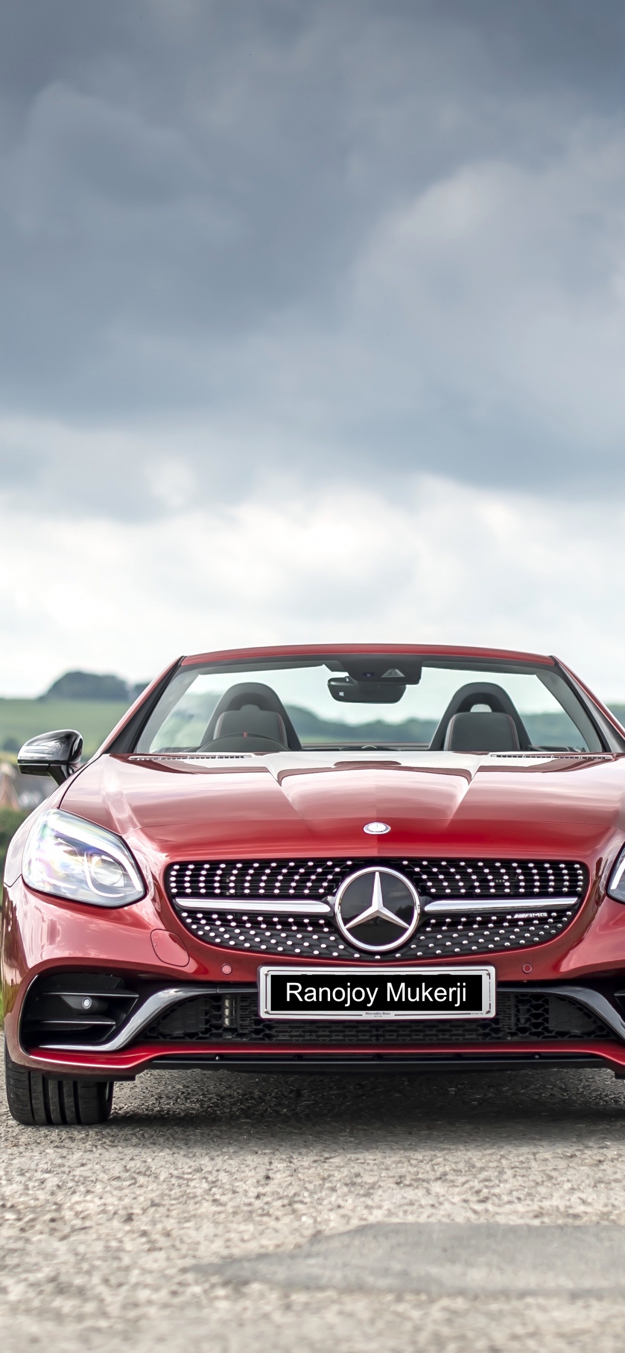 Red and White Bmw m 3 on Green Grass Field Under White Clouds and Blue Sky. Wallpaper in 1242x2688 Resolution
