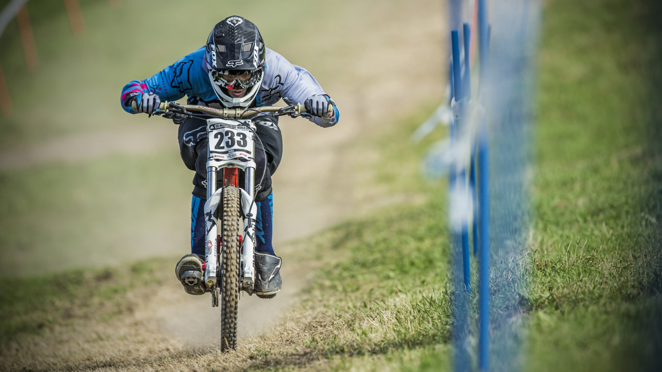 Man in Black Helmet Riding Motocross Dirt Bike. Wallpaper in 1366x768 Resolution
