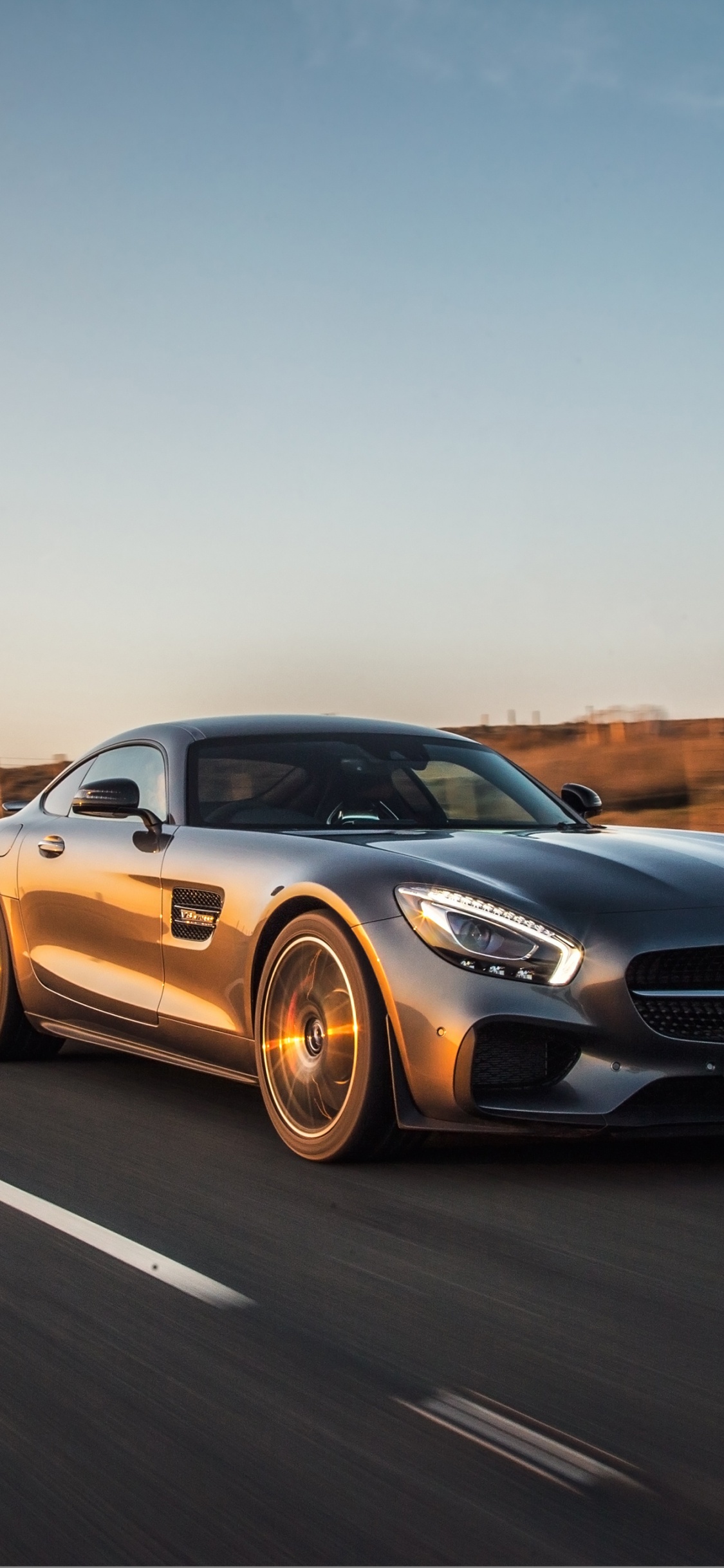 Black Audi Coupe on Road During Daytime. Wallpaper in 1125x2436 Resolution
