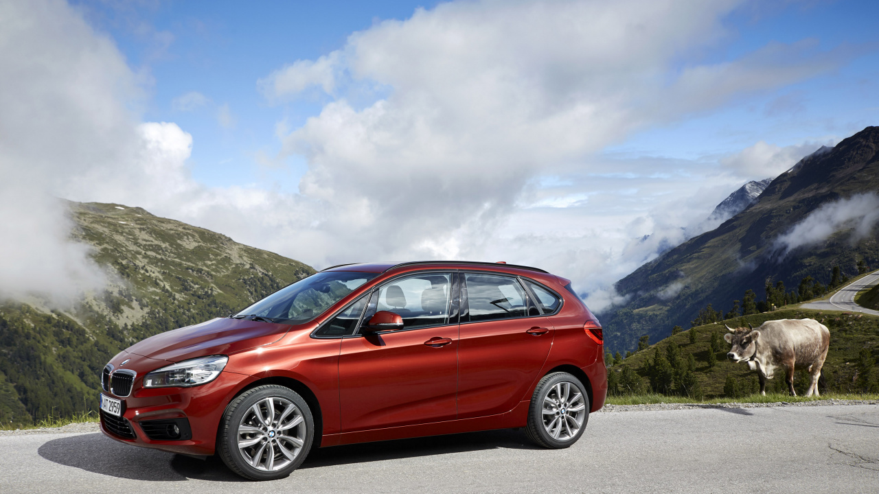 Red Honda Sedan on Road Near Mountain Under White Clouds During Daytime. Wallpaper in 1280x720 Resolution