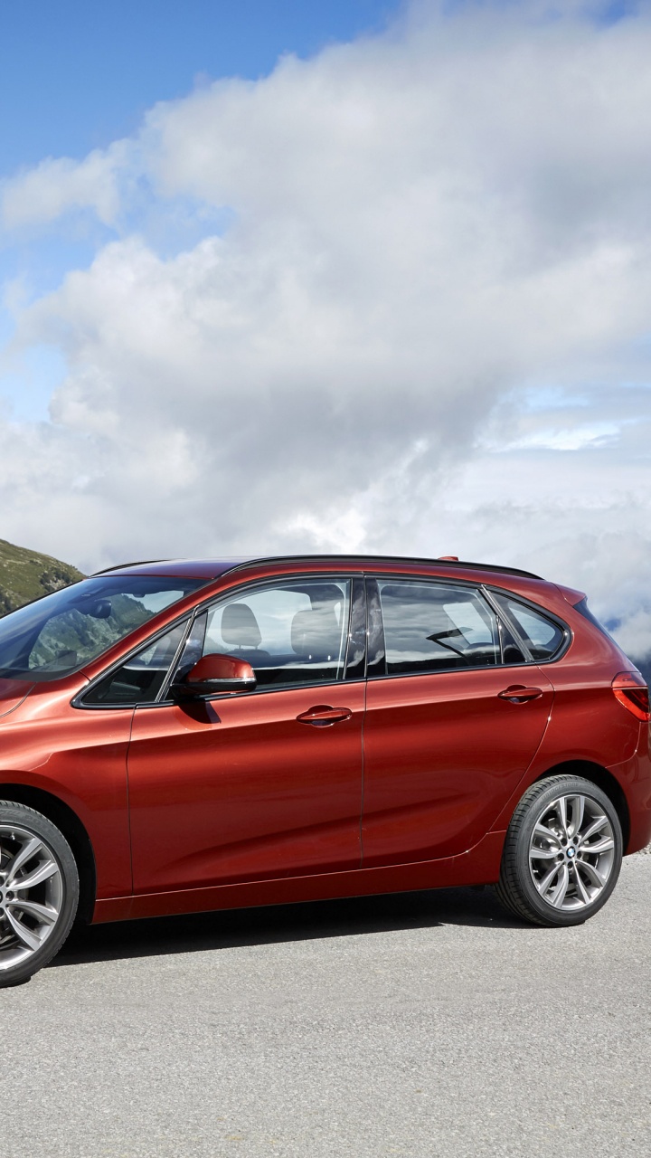 Red Honda Sedan on Road Near Mountain Under White Clouds During Daytime. Wallpaper in 720x1280 Resolution