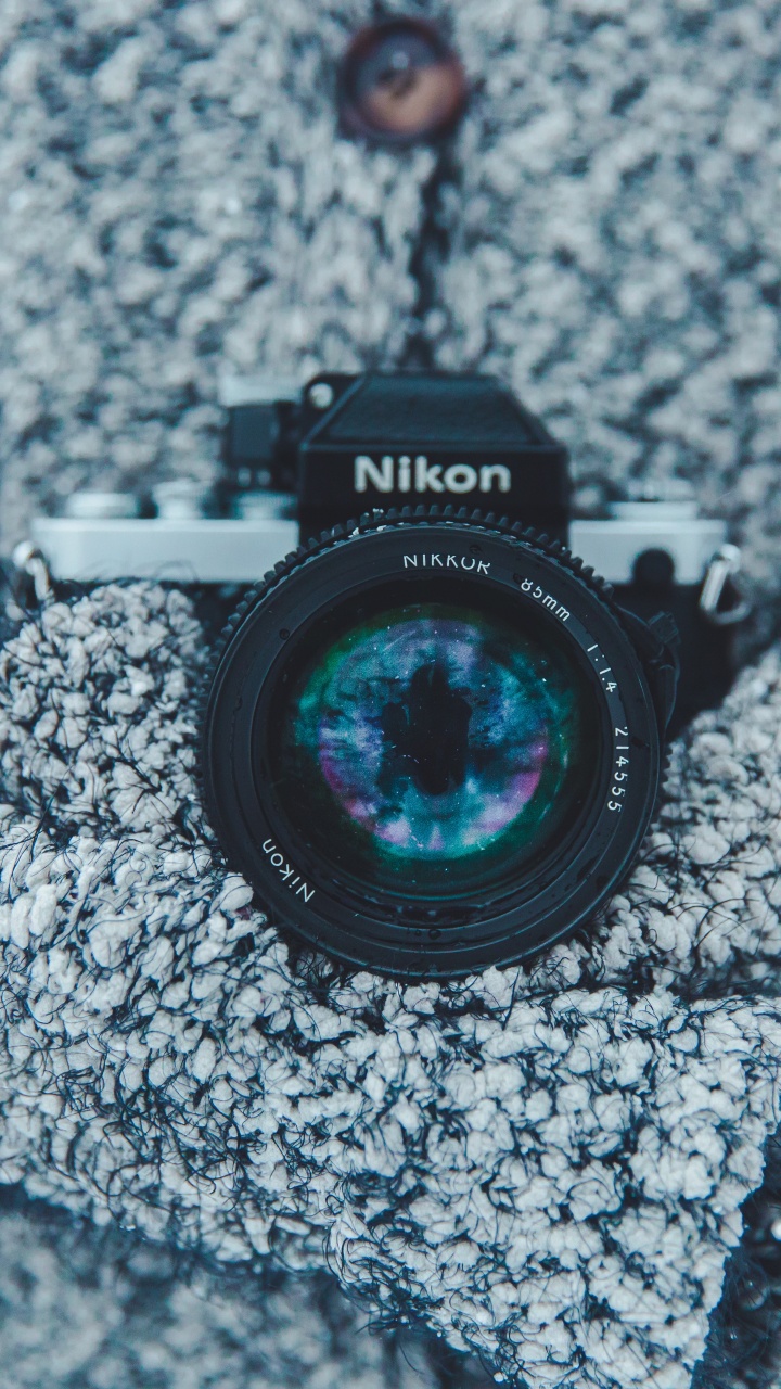 Black Nikon Dslr Camera on Gray Textile. Wallpaper in 720x1280 Resolution