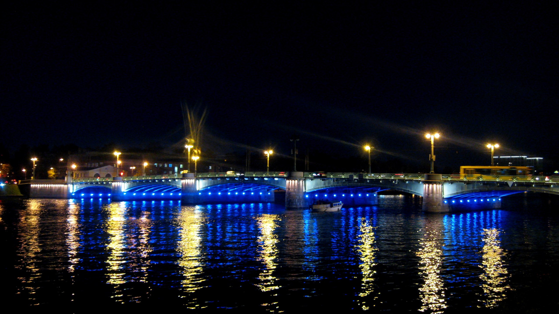 Lighted Bridge Over Body of Water During Night Time. Wallpaper in 1920x1080 Resolution