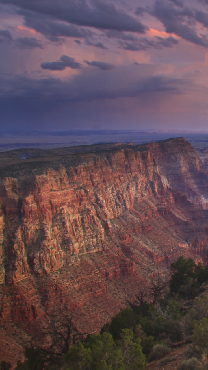 Brown Rocky Mountain Under Cloudy Sky During Daytime. Wallpaper in 720x1280 Resolution