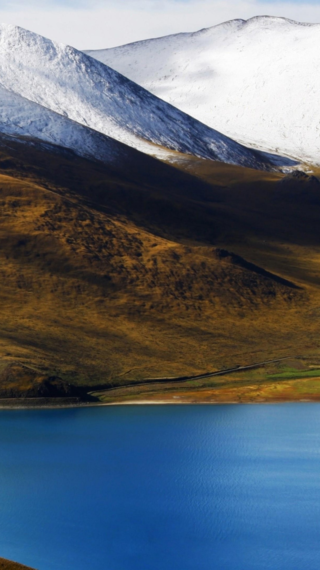 Black Car on Road Near Lake and Snow Covered Mountain During Daytime. Wallpaper in 1080x1920 Resolution