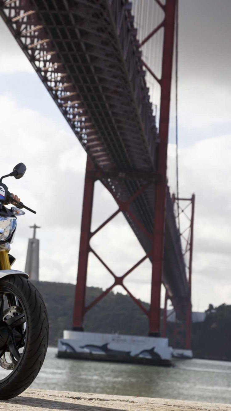 Woman in Black Jacket Riding Yellow and Black Motorcycle. Wallpaper in 750x1334 Resolution