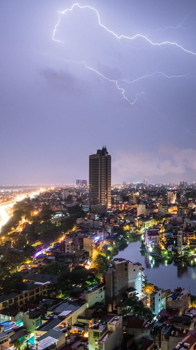City Skyline With Lightning Above During Night Time. Wallpaper in 750x1334 Resolution