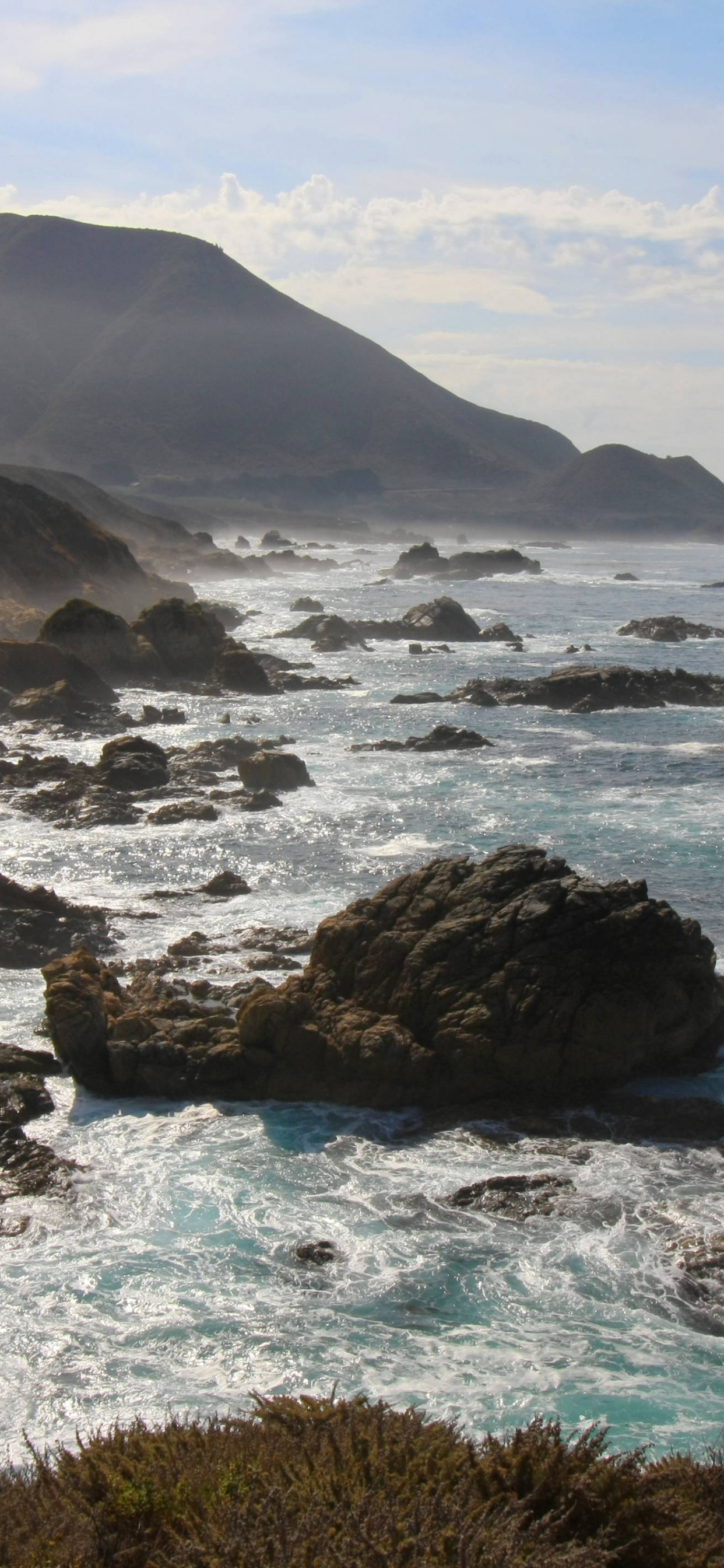 Black Rock Formation on Sea During Daytime. Wallpaper in 1242x2688 Resolution