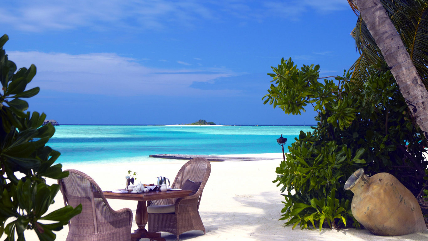 Brown Wooden Outdoor Lounge Chairs on Beach During Daytime. Wallpaper in 1366x768 Resolution