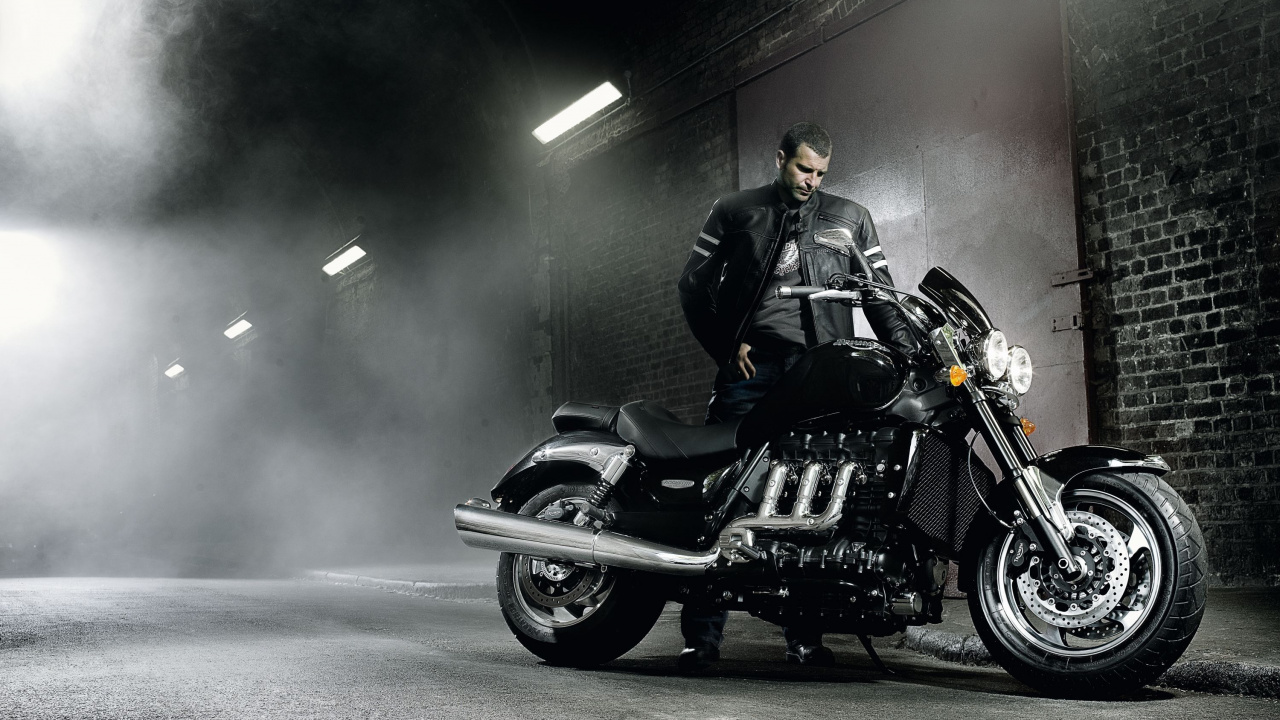 Man in Black Jacket Riding Black Motorcycle. Wallpaper in 1280x720 Resolution