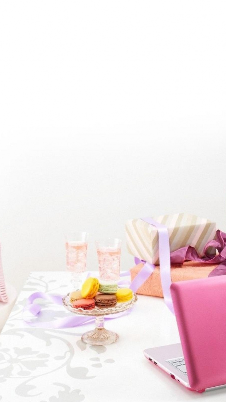 Pink Laptop Computer on Table. Wallpaper in 750x1334 Resolution