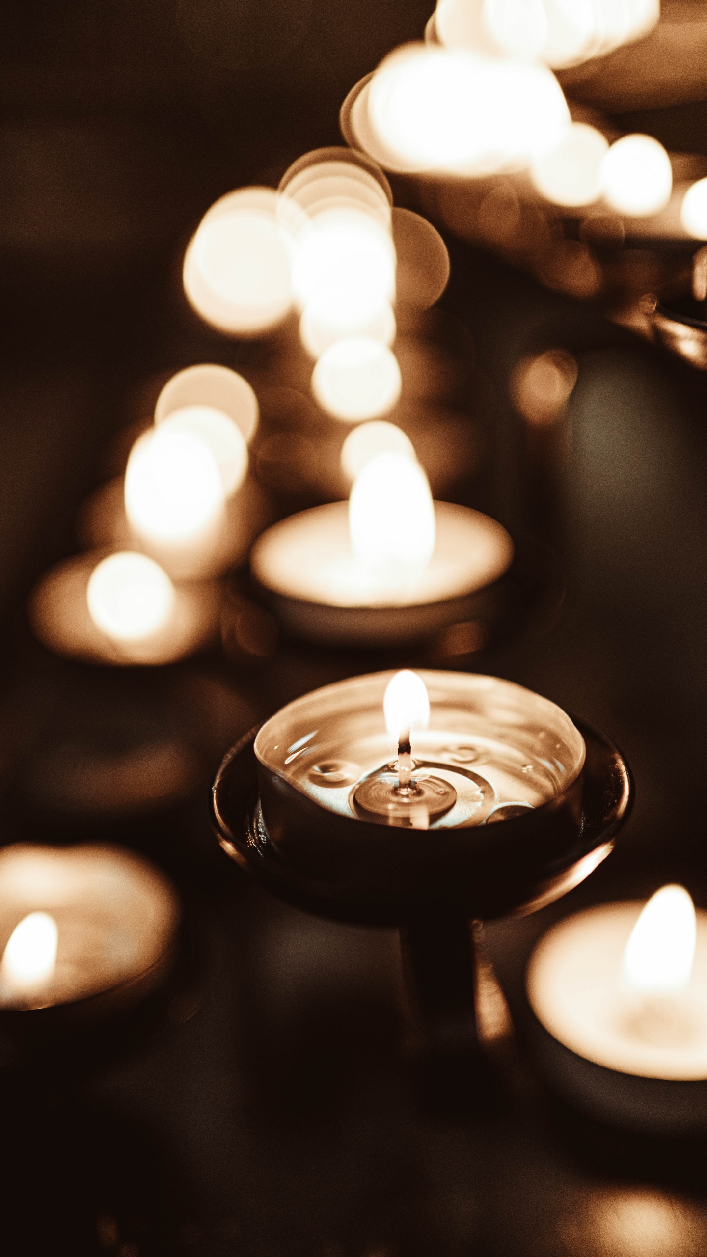 Lighted Candle in Black Holder. Wallpaper in 1440x2560 Resolution