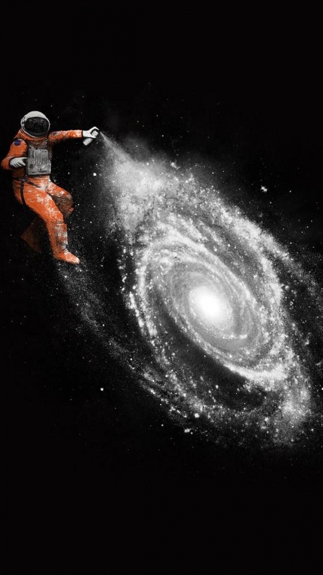 Man in Orange Jacket and Black Pants Standing on Black and White Galaxy. Wallpaper in 1080x1920 Resolution