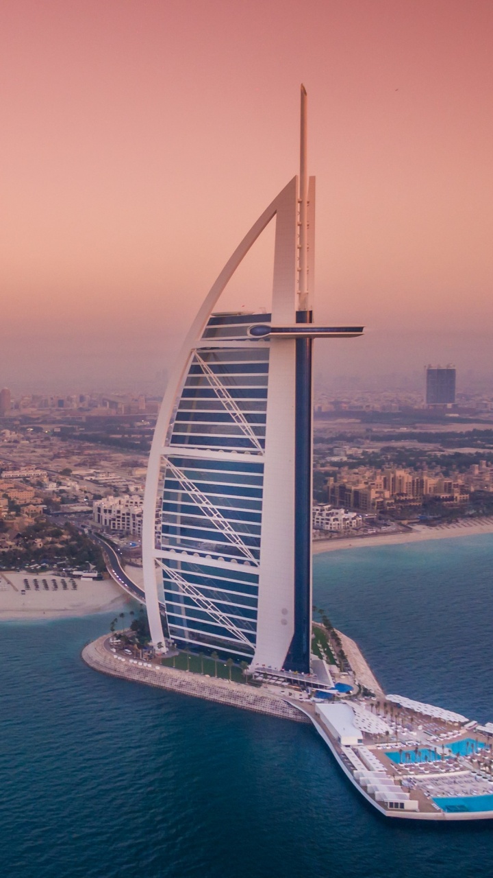 Noria Blanca y Azul Cerca Del Cuerpo de Agua Durante el Día. Wallpaper in 720x1280 Resolution