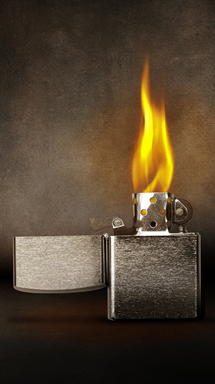 Silver Flip Lighter With Fire. Wallpaper in 750x1334 Resolution