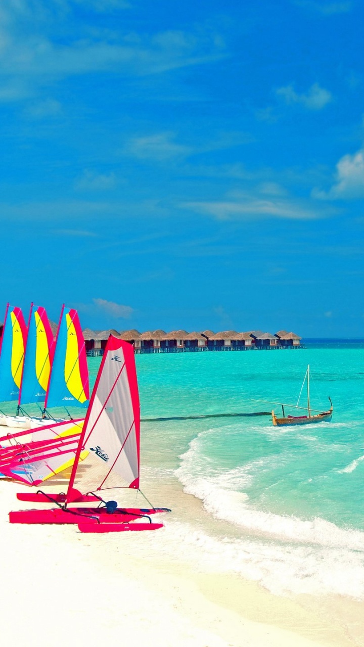Red and Blue Beach Umbrellas on Beach Shore During Daytime. Wallpaper in 720x1280 Resolution