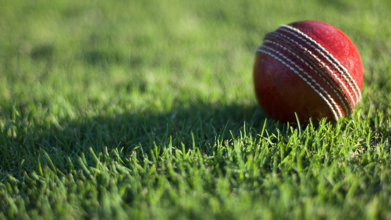 Red and White Ball on Green Grass Field During Daytime. Wallpaper in 1366x768 Resolution