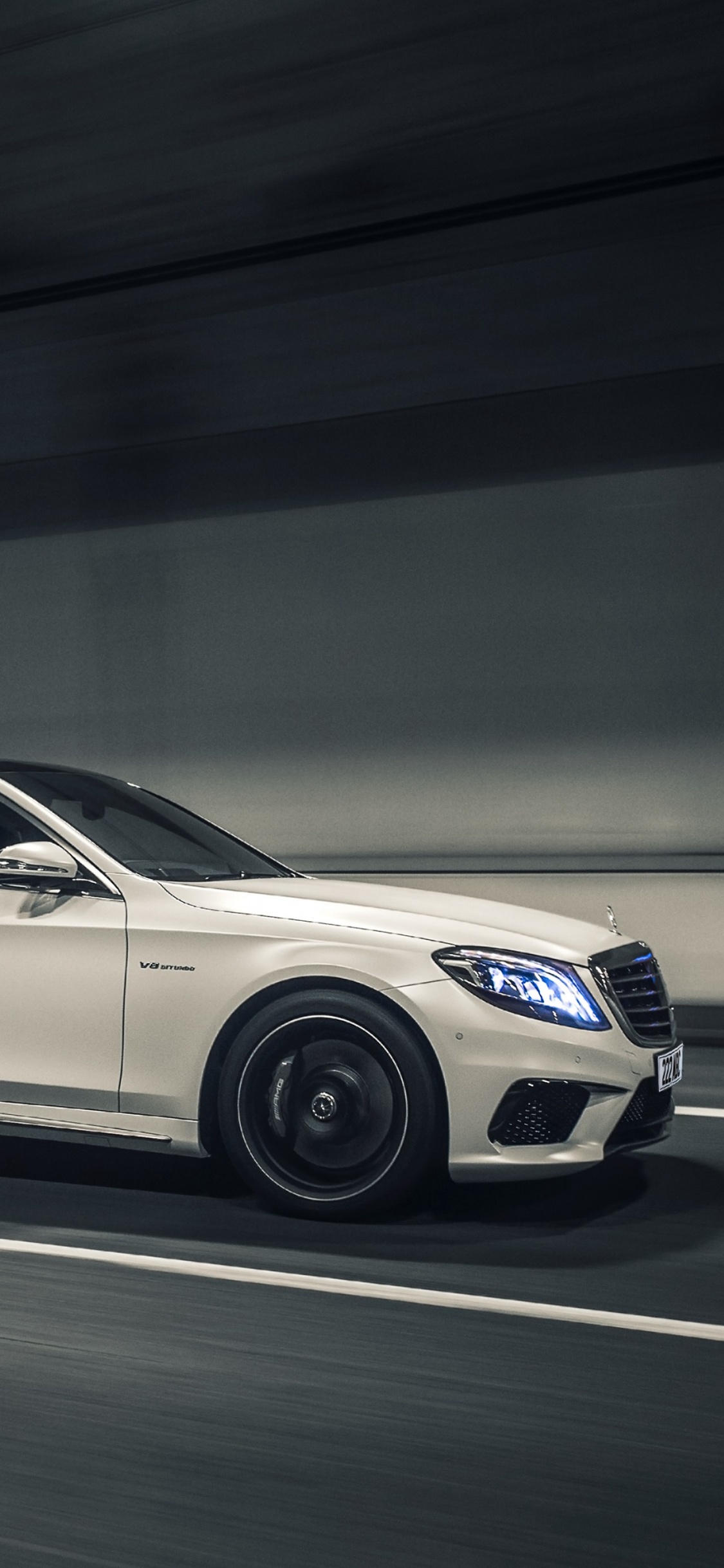 White Mercedes Benz Coupe on Road. Wallpaper in 1125x2436 Resolution