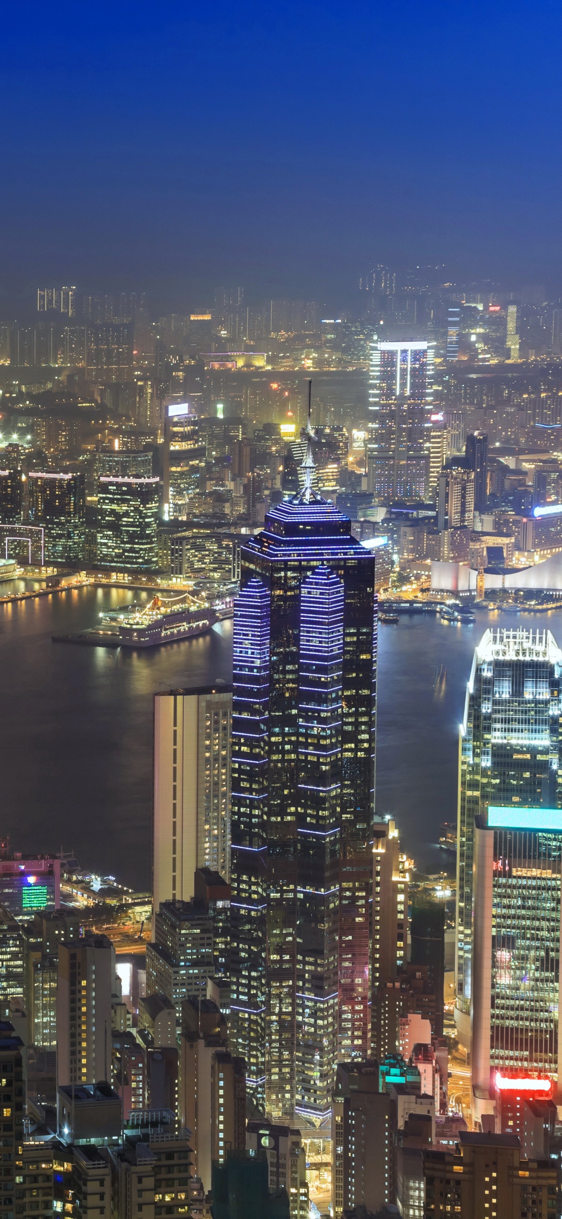 City Skyline During Night Time. Wallpaper in 1125x2436 Resolution