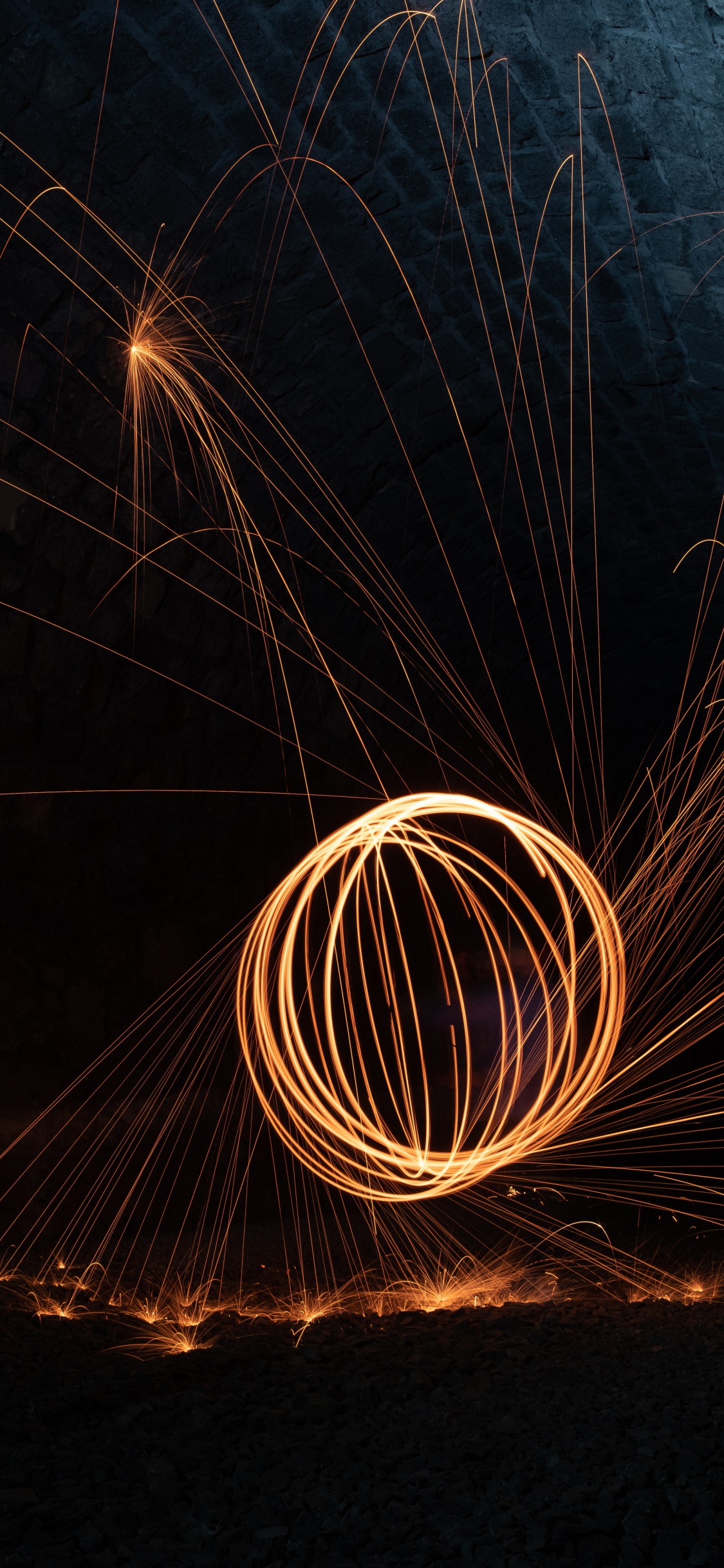 Steel Wool Photography of Man in Black Shirt. Wallpaper in 1125x2436 Resolution