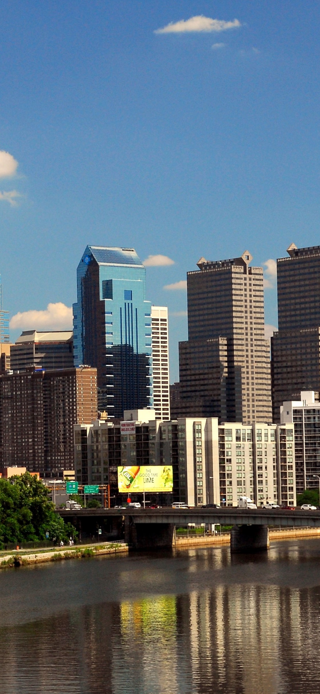 City Skyline Under Blue Sky During Daytime. Wallpaper in 1125x2436 Resolution