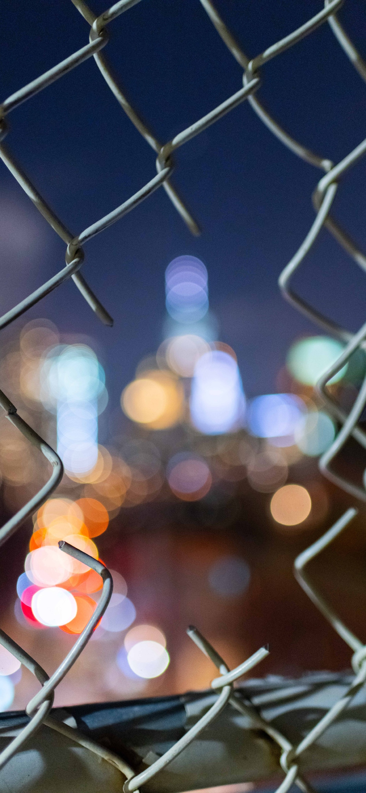Bokeh Photography of Gray Metal Fence. Wallpaper in 1242x2688 Resolution