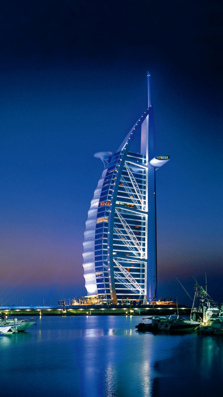 Green and White Boat on Dock During Night Time. Wallpaper in 750x1334 Resolution