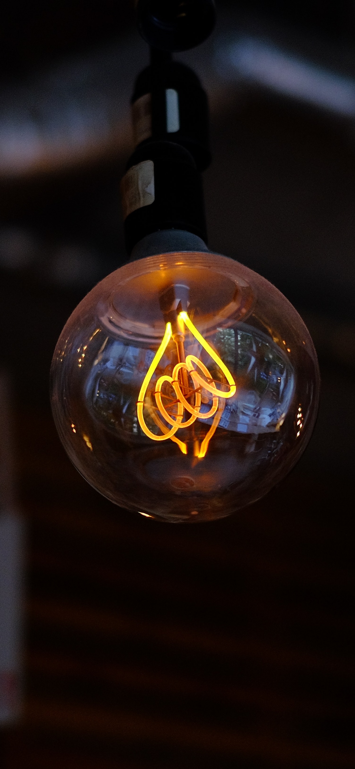 Clear Glass Bulb With Black Strap. Wallpaper in 1242x2688 Resolution