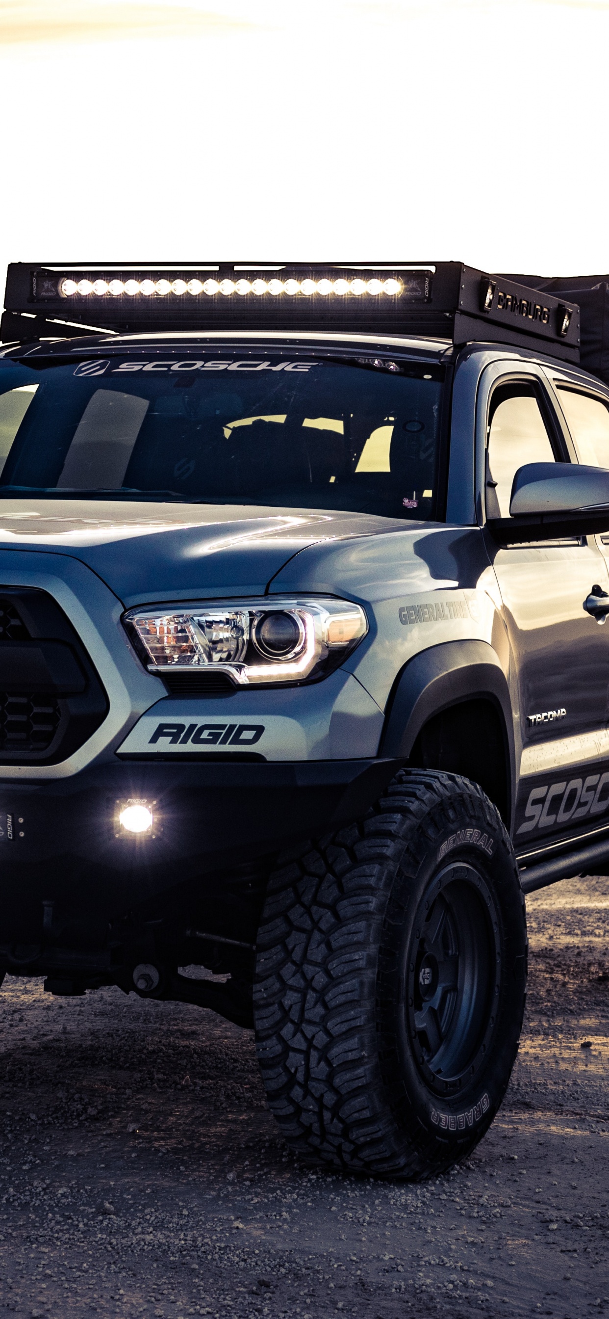 Black and Silver Nissan Suv. Wallpaper in 1242x2688 Resolution