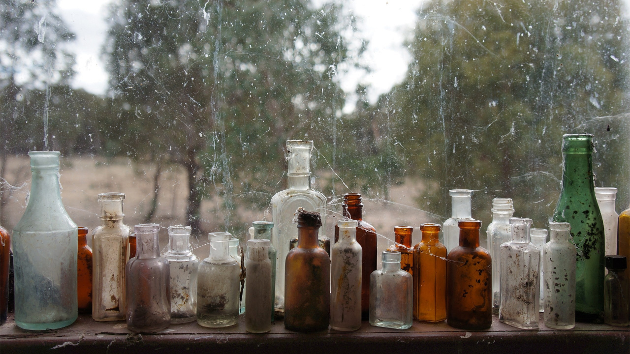 Clear Glass Bottles on Brown Wooden Table. Wallpaper in 1280x720 Resolution