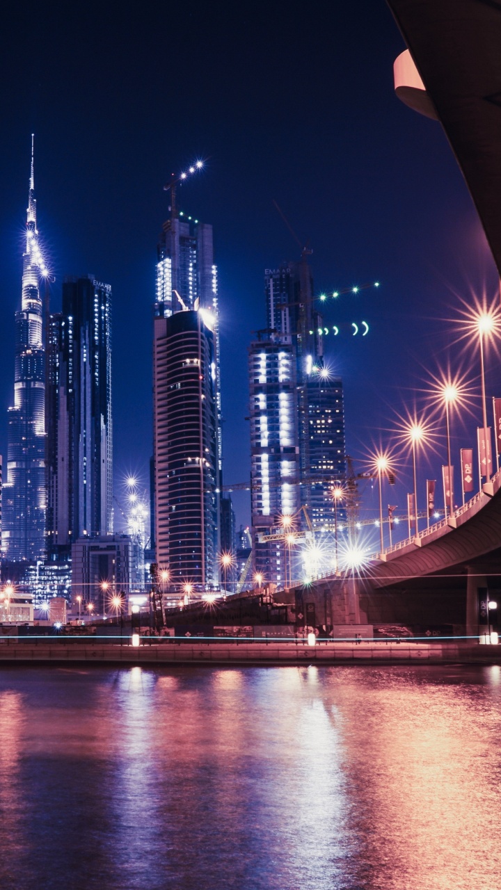 City Skyline During Night Time. Wallpaper in 720x1280 Resolution