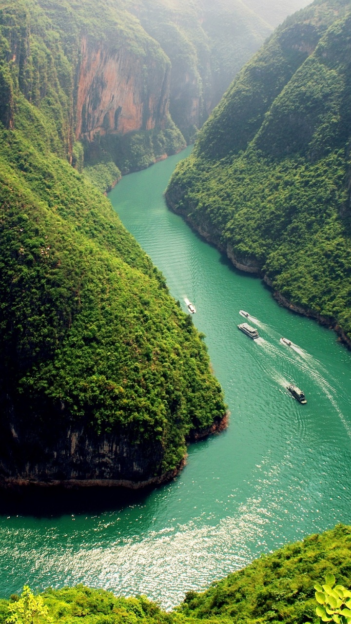 Green and Brown Mountain Beside Body of Water During Daytime. Wallpaper in 720x1280 Resolution
