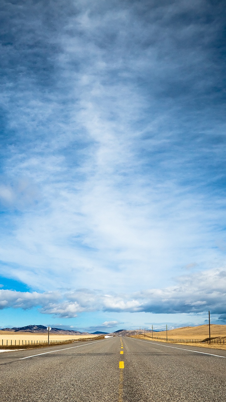 Gray Concrete Road Under Blue Sky. Wallpaper in 720x1280 Resolution