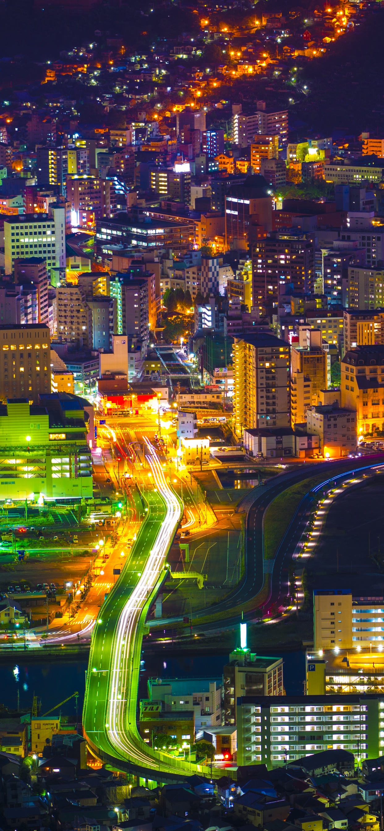 City With High Rise Buildings During Night Time. Wallpaper in 1242x2688 Resolution