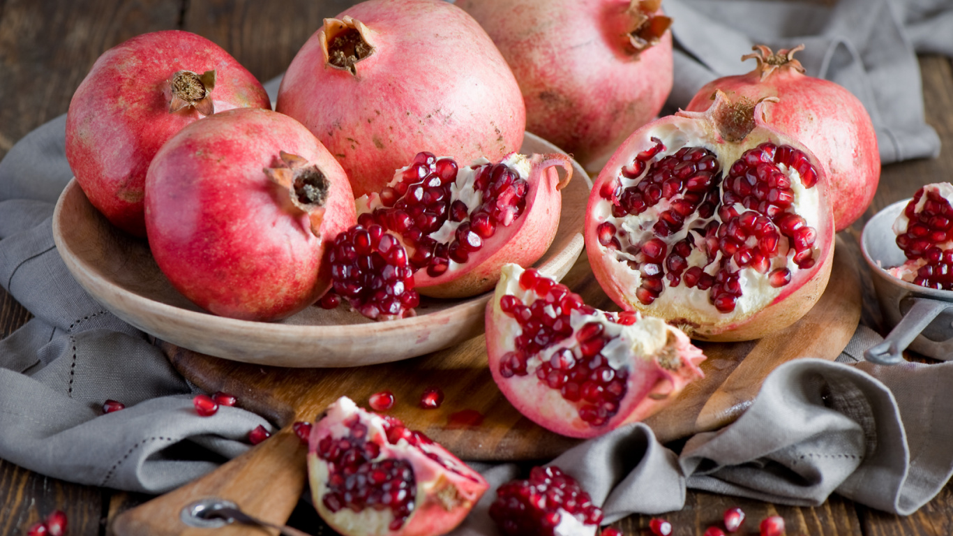Red Pomegranate Fruit on Brown Wooden Chopping Board. Wallpaper in 1366x768 Resolution