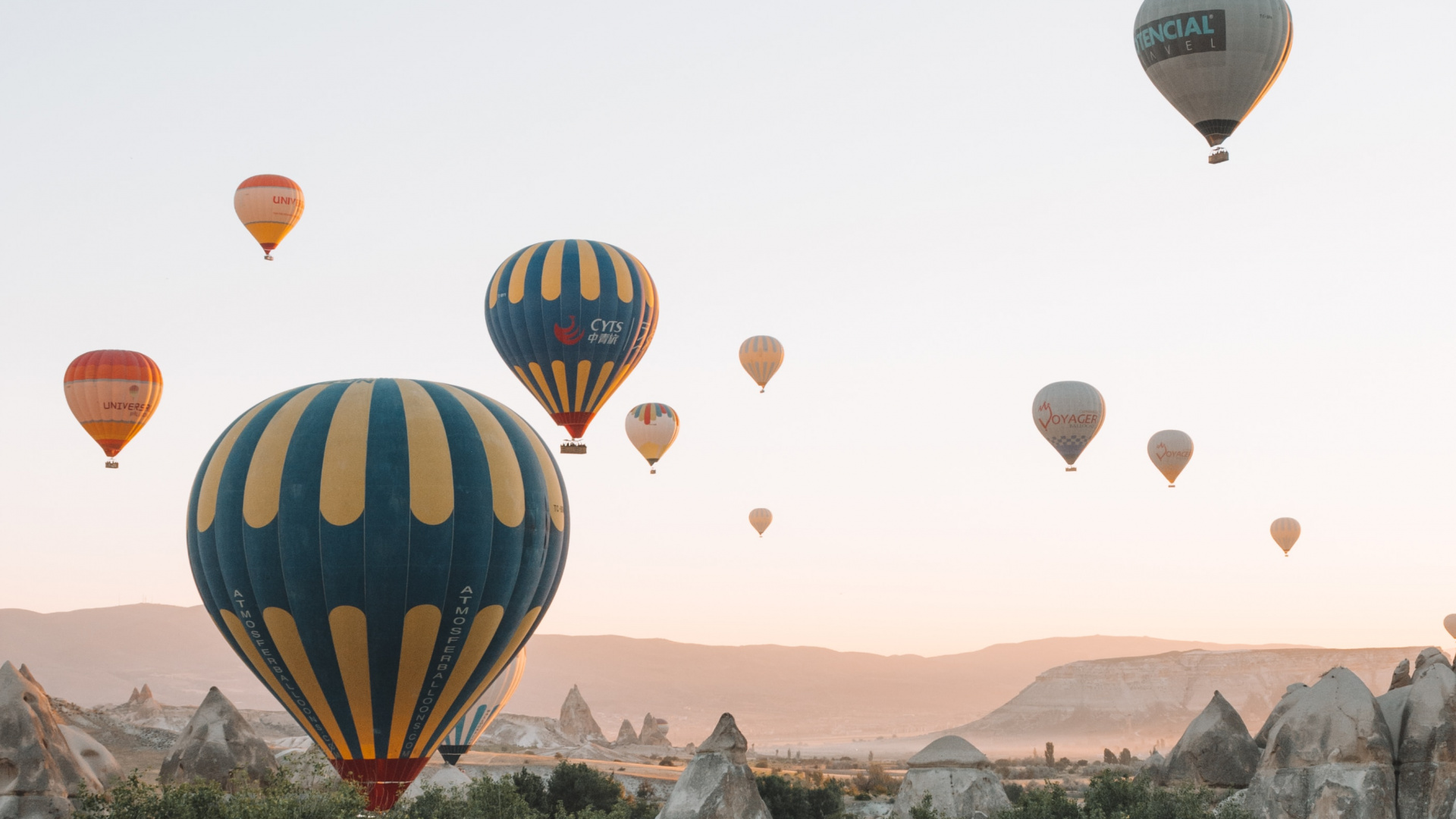 Hot Air Balloons Flying Over Green Trees During Daytime. Wallpaper in 1920x1080 Resolution