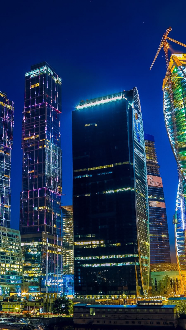 City Buildings With Lights During Night Time. Wallpaper in 750x1334 Resolution