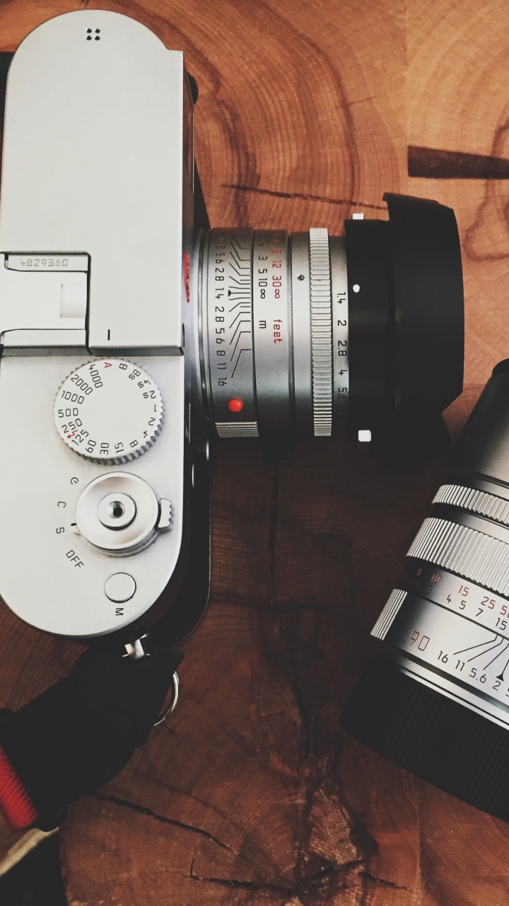 Black and Silver Dslr Camera Beside Black and White Coffee Cup. Wallpaper in 720x1280 Resolution