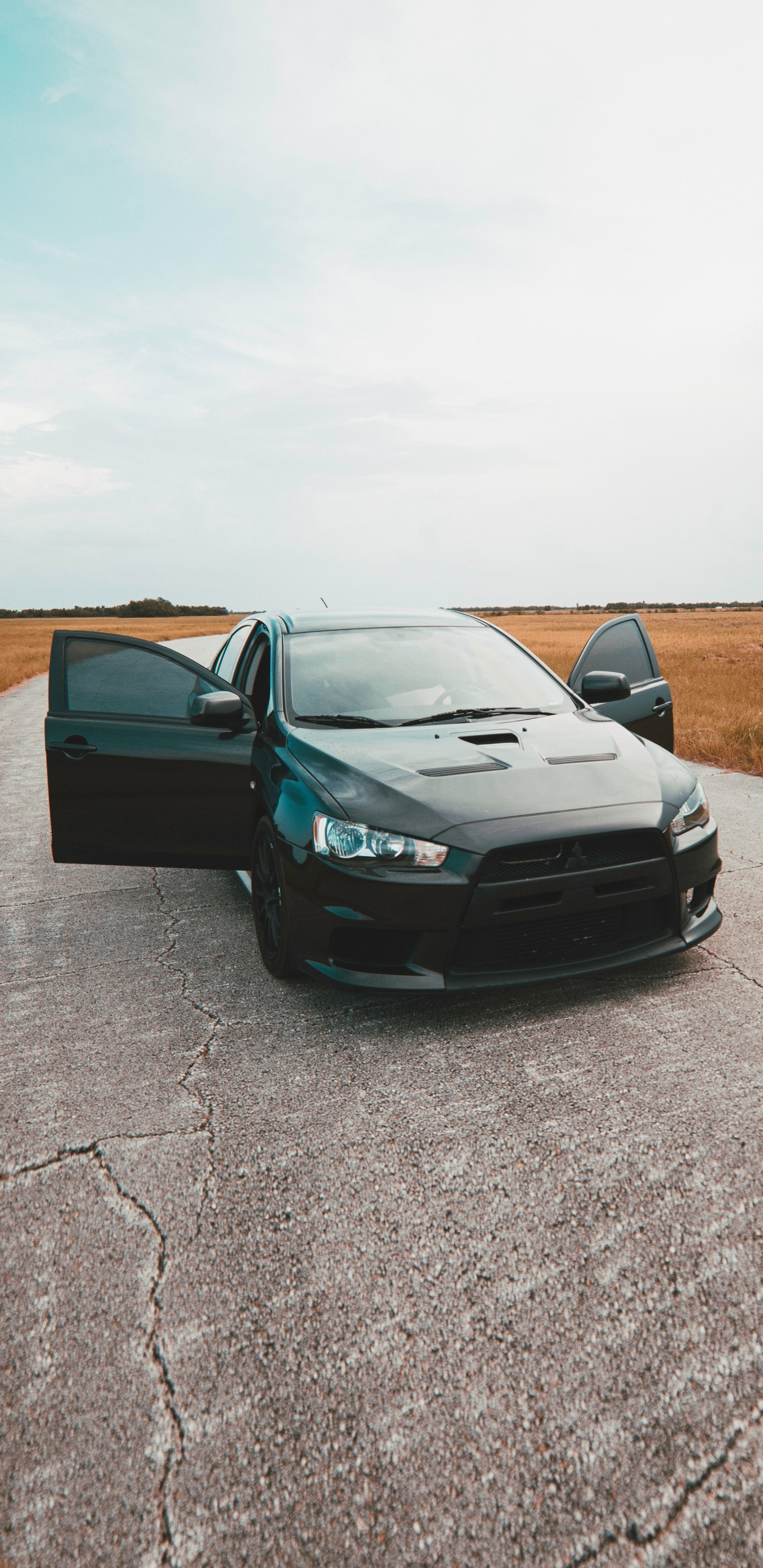 Black Chevrolet Camaro on Road During Daytime. Wallpaper in 1440x2960 Resolution