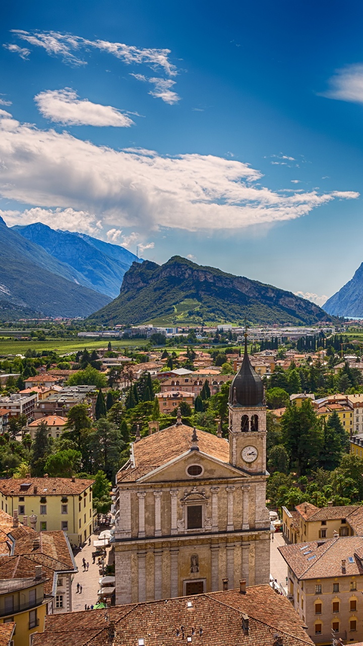 Brown Concrete Building Near Green Trees Under Blue Sky During Daytime. Wallpaper in 720x1280 Resolution