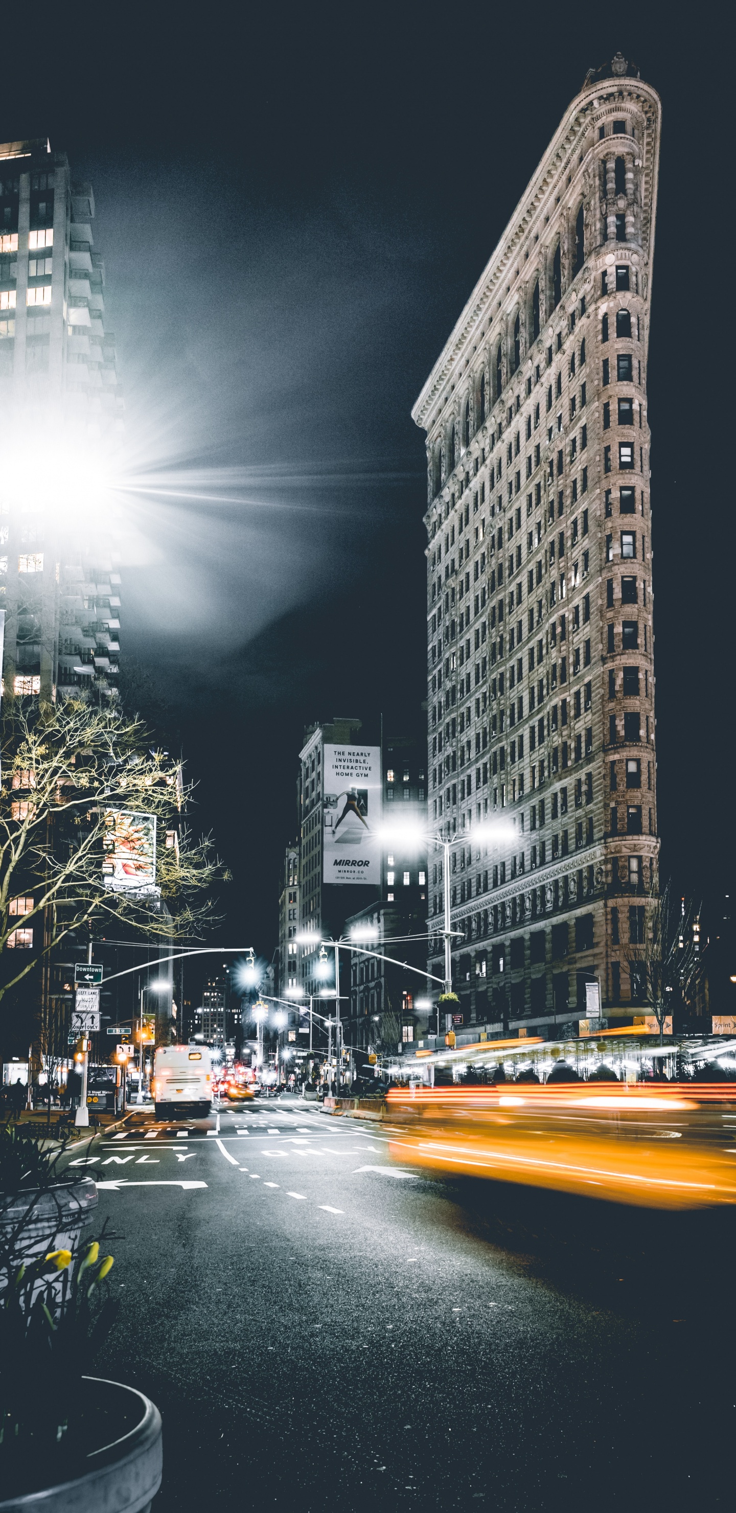 Cars on Road Near High Rise Buildings During Night Time. Wallpaper in 1440x2960 Resolution