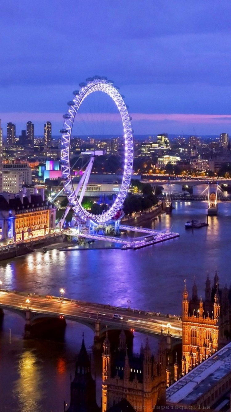 Ferris Wheel Near City Buildings During Night Time. Wallpaper in 750x1334 Resolution