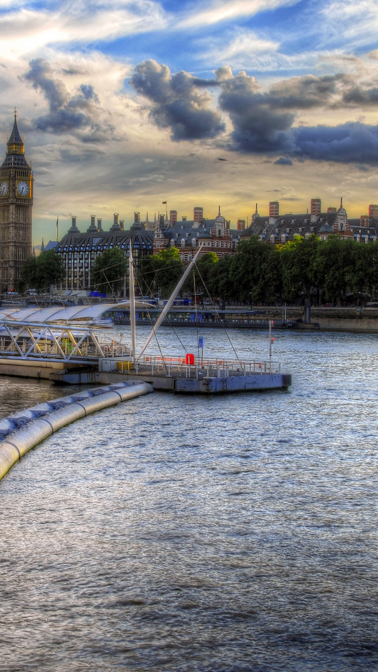 White Boat on Dock Near City Buildings Under Cloudy Sky During Daytime. Wallpaper in 750x1334 Resolution