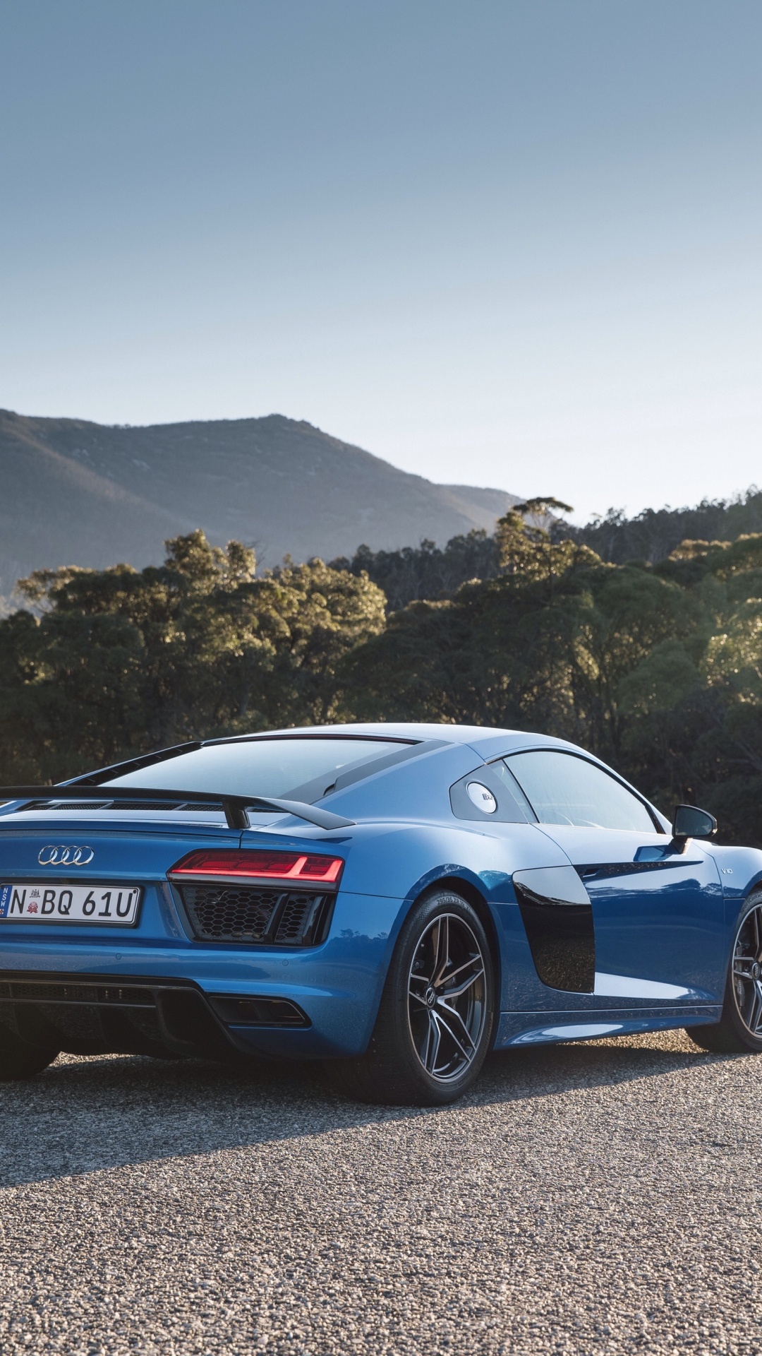 Blue Porsche 911 on Gray Dirt Road During Daytime. Wallpaper in 1080x1920 Resolution