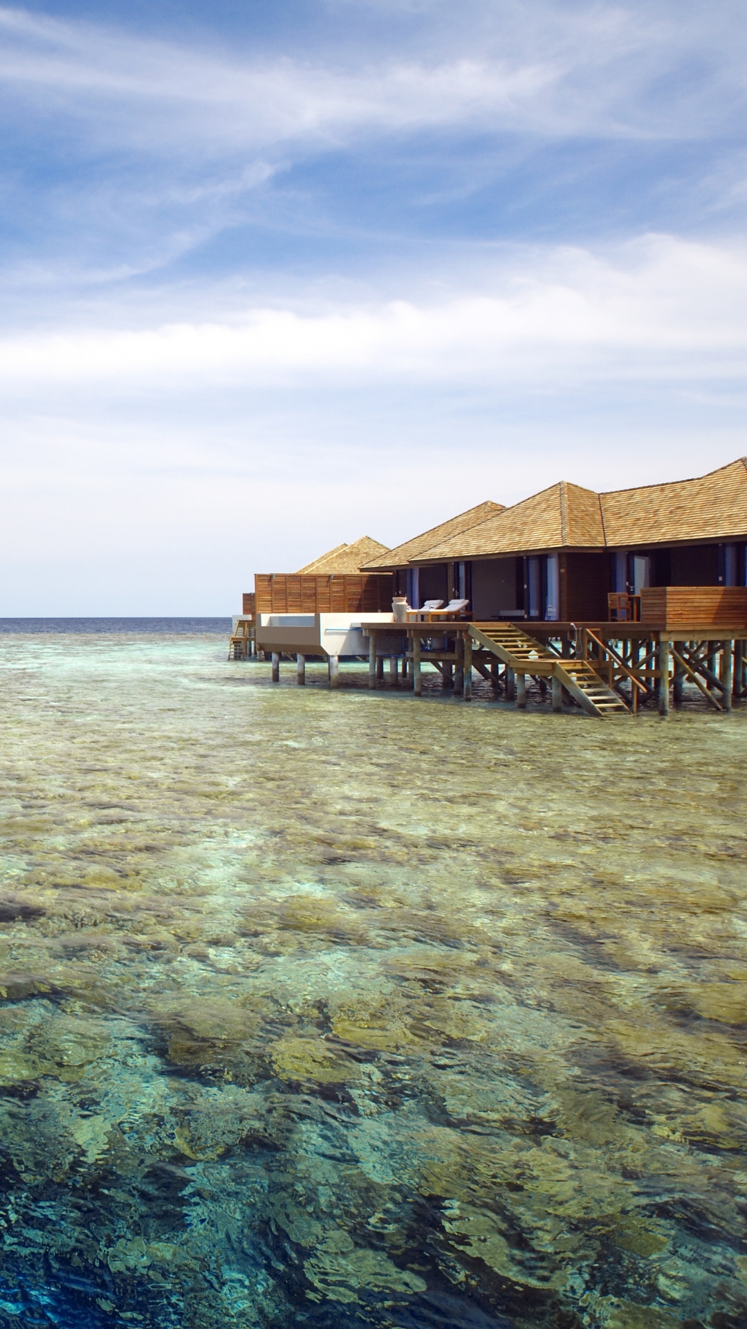 Brown Wooden House on Body of Water Under Blue Sky During Daytime. Wallpaper in 1080x1920 Resolution