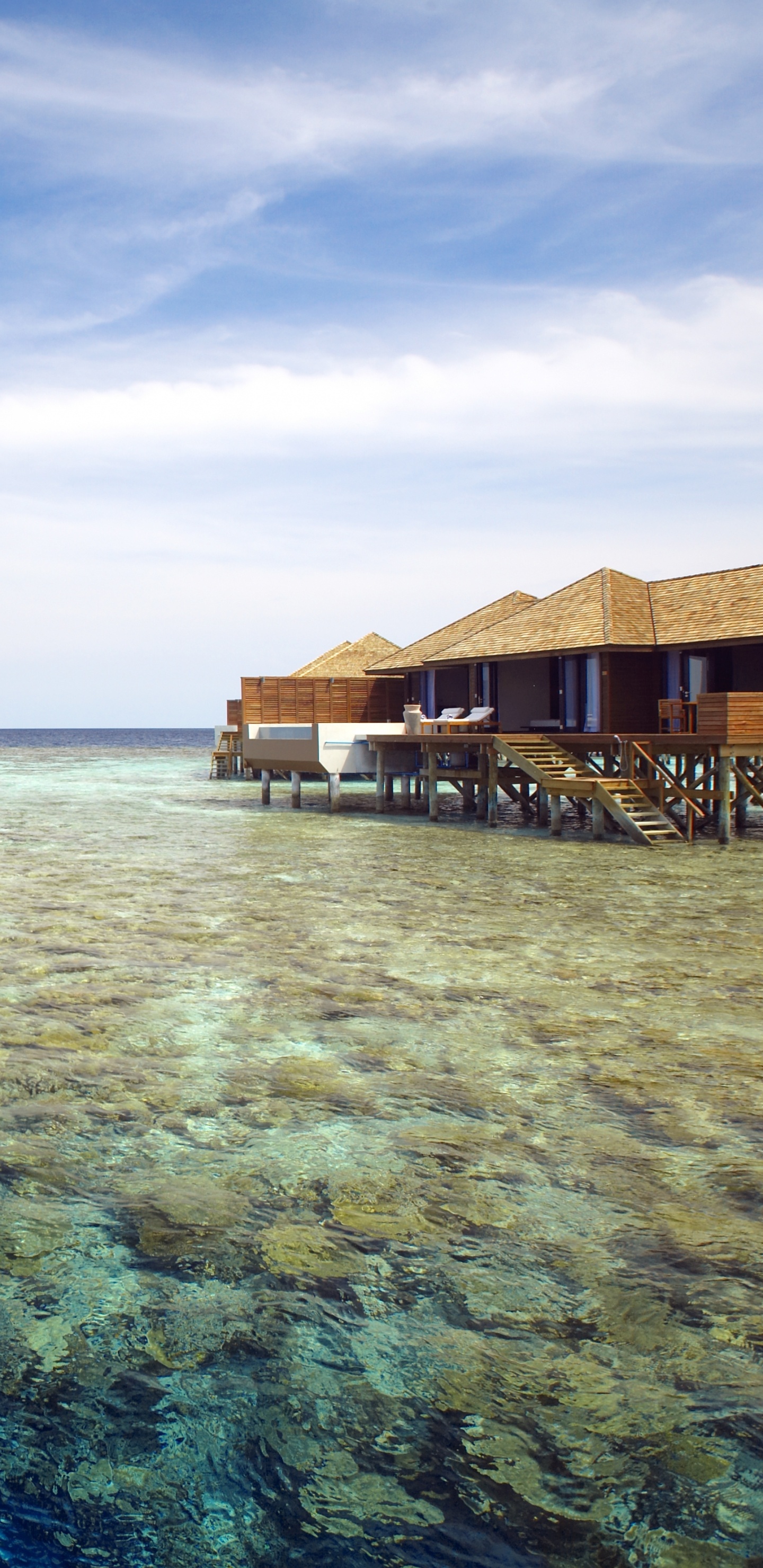 Brown Wooden House on Body of Water Under Blue Sky During Daytime. Wallpaper in 1440x2960 Resolution