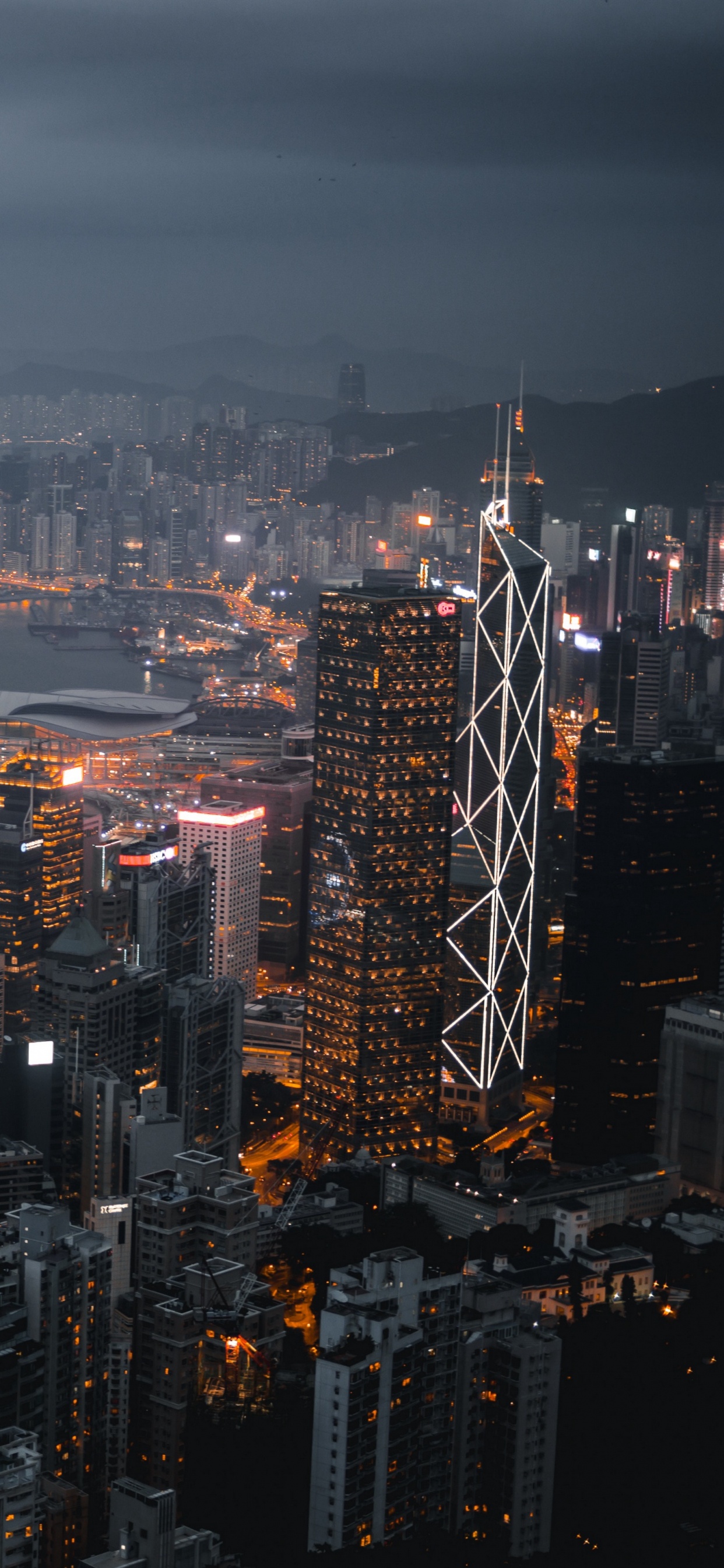 Aerial View of City Buildings During Night Time. Wallpaper in 1242x2688 Resolution